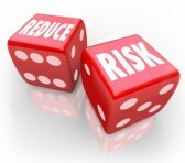 33003996-reduce-risk-words-on-two-red-dice-to-illustrate-lowering-your-chances-for-liability-danger-hazard-or